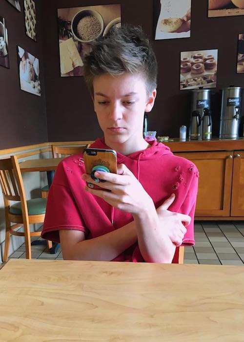 Weston Koury checking his phone as seen in January 2017