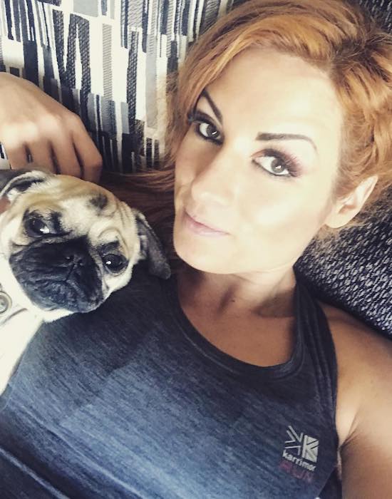 Becky Lynch with her pet pug dog Studley Money as seen in January 2018