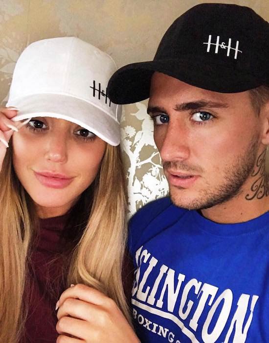 Charlotte Letitia Crosby and Stephen Bear wearing hats from HIS & HERS in June 2017