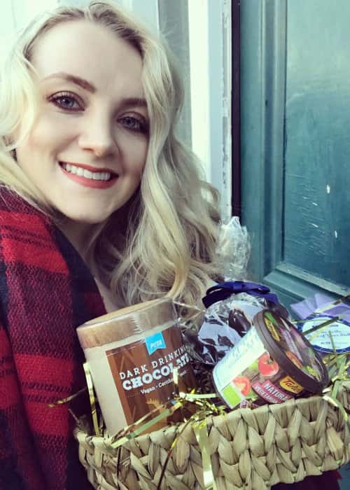 Evanna Lynch promoting PETA's vegan holiday gift baskets in a selfie as seen in December 2017