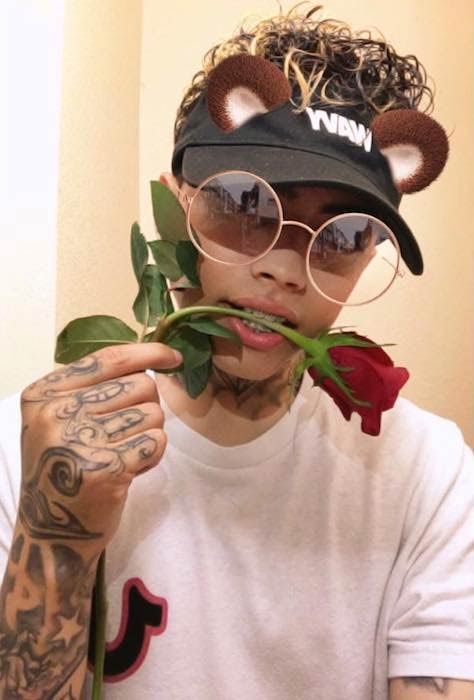 Frimzy offering red rose in a June 2017 picture