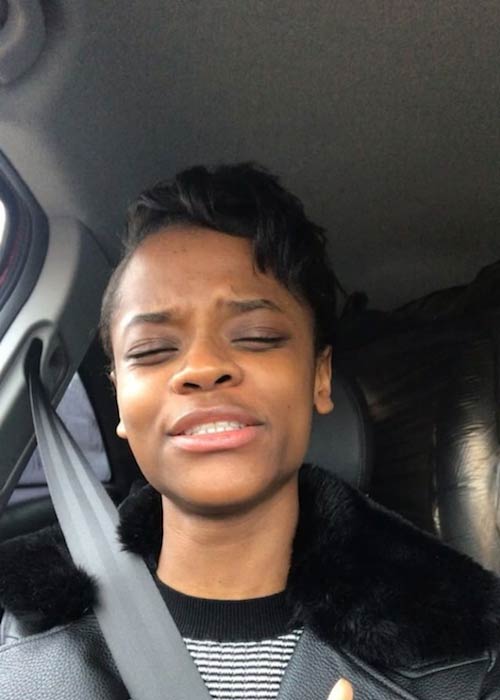 Letitia Wright singing with her sister in her car in 2018