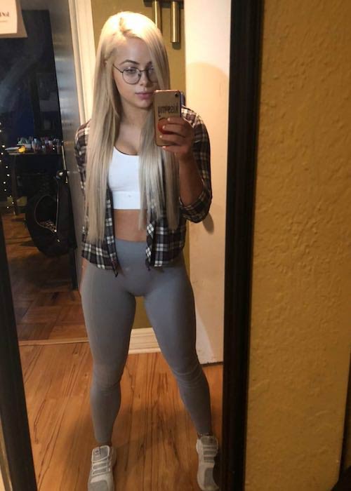 Liv Morgan geeky look in spectacles and gray leggings in 2018