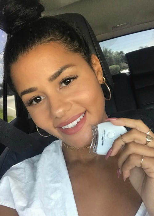 Katya Elise Henry promoting BrighterWhite in a selfie in August 2017