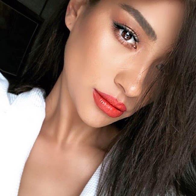 Shay Mitchell showing her face with makeup done in 2018