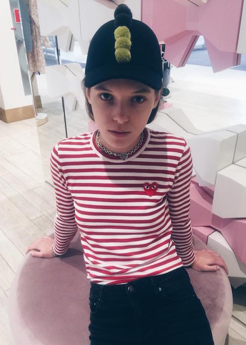 Anna K wearing Comme des Garcons cap in a December 2017 pic