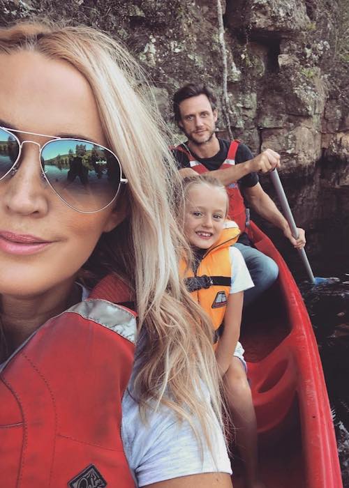 Jackie O with her husband and daughter enjoying outdoors in March 2018