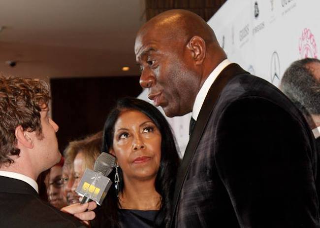 Magic Johnson with wife Cookie Johnson at the Mercedes-Benz Carousel of Hope Gala 2014