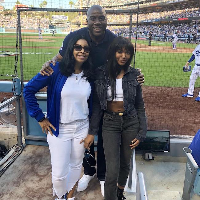 Magic Johnson with wife Cookie Johnson (Left) and daughter Elisa Johnson at the baseball match of Los Angeles Dodgers in 2018