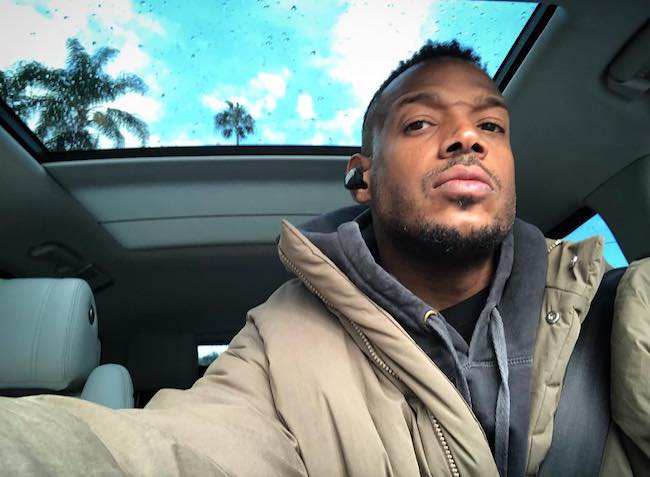 Marlon Wayans inside his car with sunroof open in April 2018