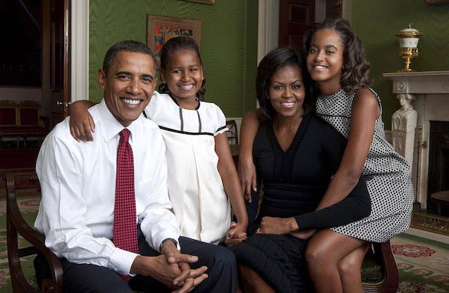 President Barack Obama, First Lady Michelle Obama, and their daughters, Sasha and Malia posing for a family portrait inside White House in September 2009