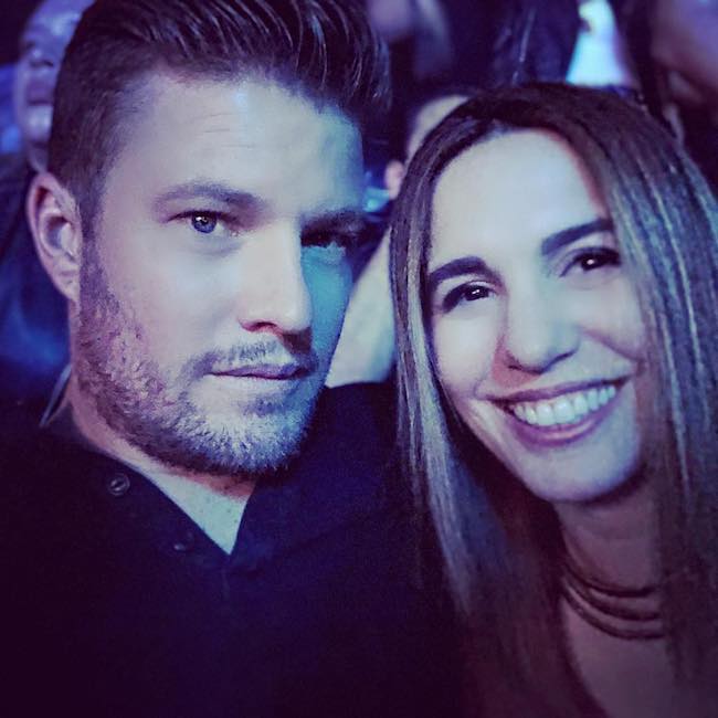 Christy Carlson Romano with her husband Brendan Rooney at Honda Center in May 2018