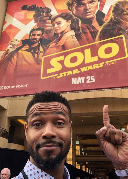 Isaiah Mustafa in a selfie in May 2018 with Star Wars movie poster