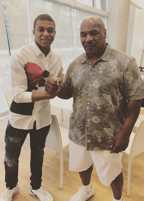 Kylian Mbappé with former boxer Mike Tyson