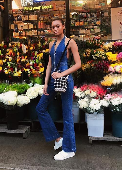 Lameka Fox looking colorful in front of a flower shop in February 2018