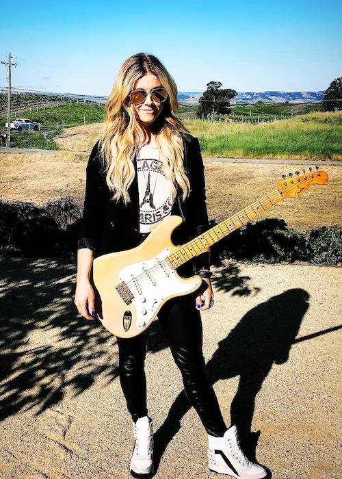 Lindsay Ell with her guitar at Liana Estates in May 2018