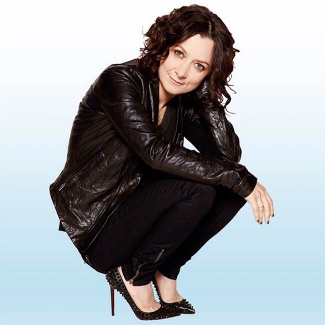 Sara Gilbert in a crouched pose in December 2014