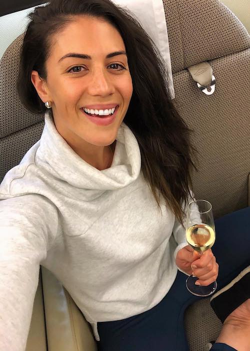 Stephanie Rice on Qantas airlines having a drink in April 2018