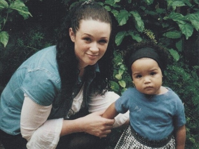 A baby Aisha Dee with her mother