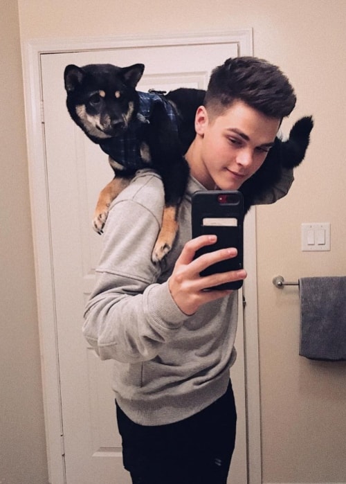 AJ Mitchell in a mirror selfie with his dog in March 2018