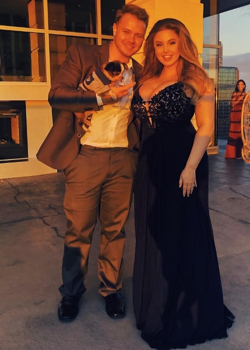 Ashley Alexiss with Travis Yohe and their pet dog during FAVIANA's East Coast Oscars event in March 2018