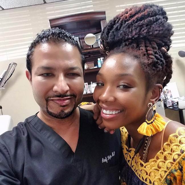 Brandy Norwood with cosmetic surgeon Dr. Aref Bhuiya in February 2018