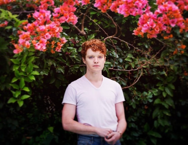 Brendan Scannell posing amidst a charming backdrop in March 2018