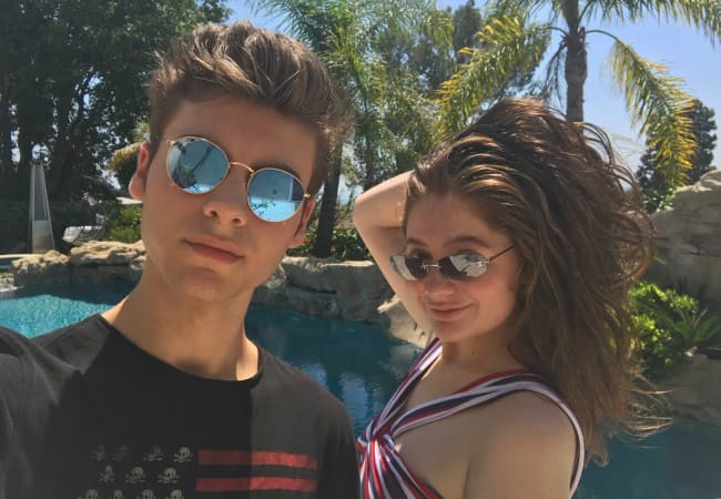 Emma Kenney and Christian Weissmann as seen in July 2018