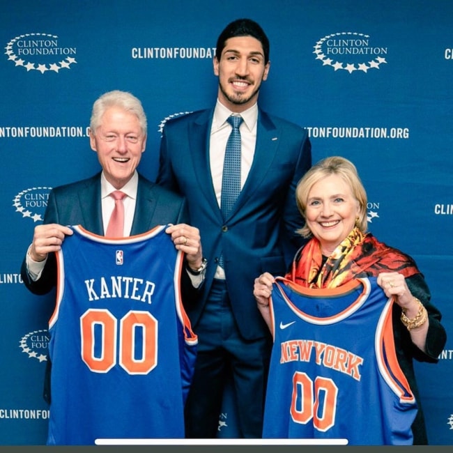 Enes Kanter (Centre) with Bill Clinton and Hillary Clinton in June 2018