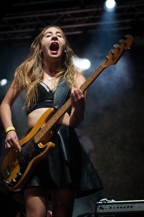 Este Haim performing in Finland at the Ilosaarirock festival in Joensuu in 2014