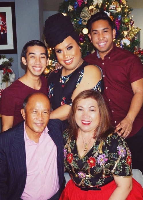 Patrick Starrr posing with his family in December 2016