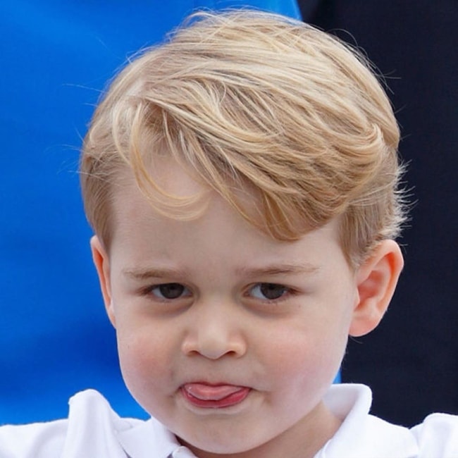 Prince George posing for the paparazzi