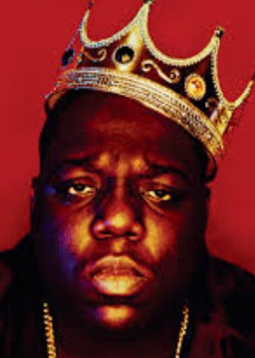 The Notorious B.I.G in a king-like pose