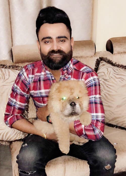 Amrit Maan with his pet dog as seen in March 2018