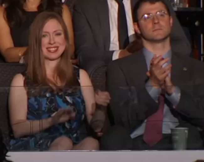 Chelsea Clinton with Marc Mezvinsky while listening to Bill Clinton's speech in 2016