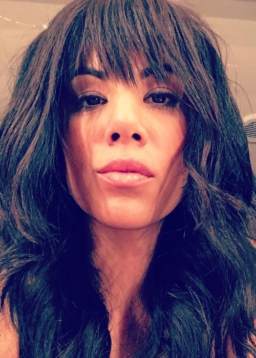 Chrissie Fit capturing her bangs in an Instagram selfie