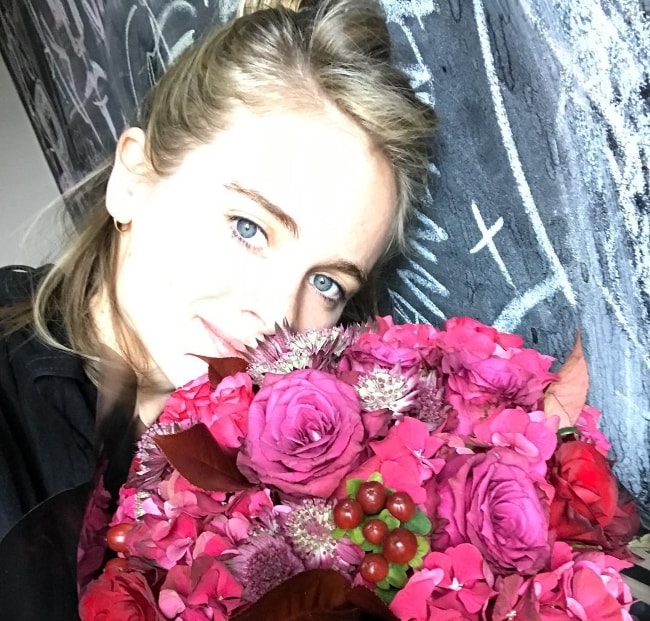 Cressida Bonas in an Instagram selfie with a bouquet in June 2017