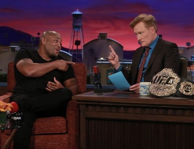 Daniel Cormier (Left) at Conan O'Brien's talk show