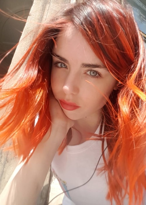 Danielle Sharp in an auburn-haired selfie in May 2018