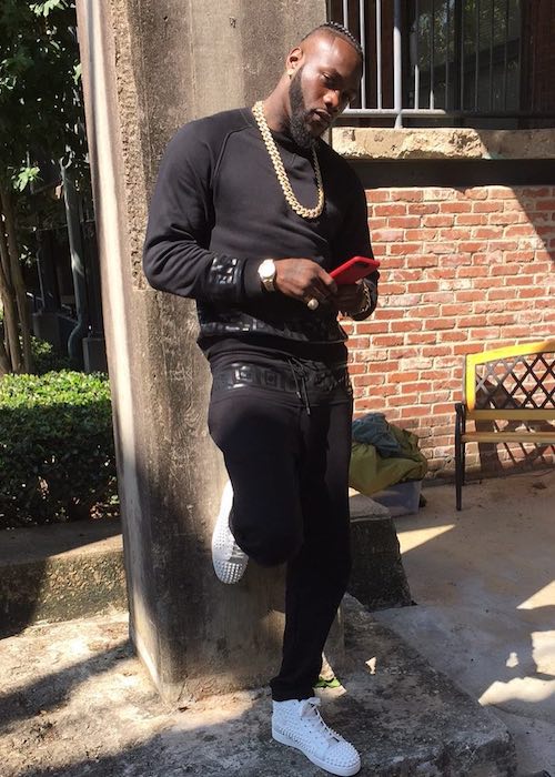 Deontay Wilder looks dapper in white shoes and black dress in September 2017