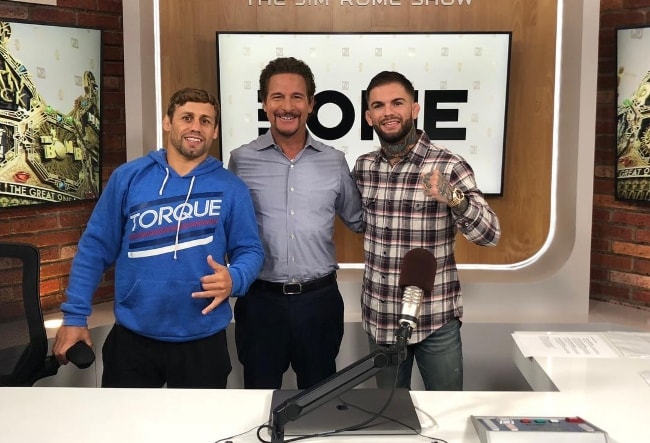 Jim Rome with Cody Garbrandt (Right) and Urijah Faber (Left) in May 2018