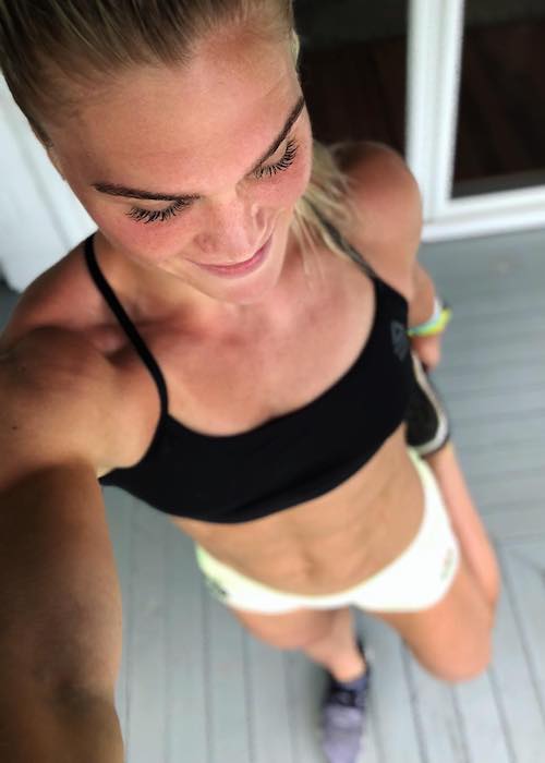 Katrín Davíðsdóttir heading for a workout session in her black sports bra in July 2018