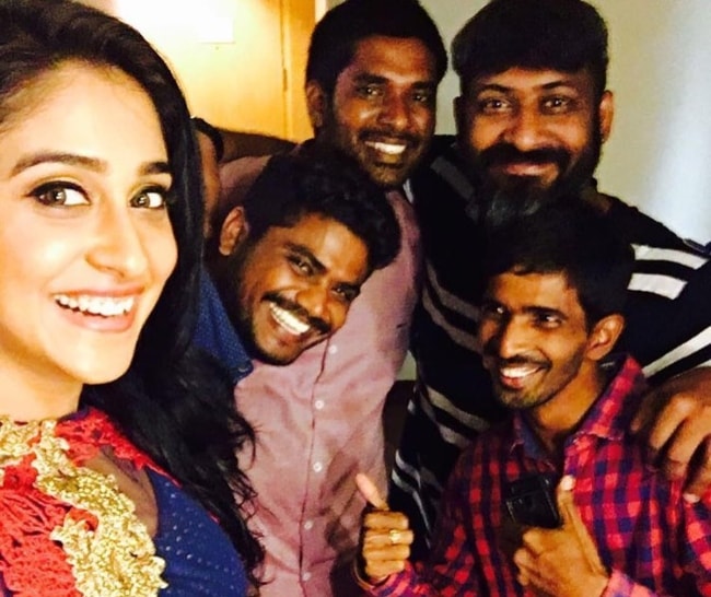 Regina Cassandra in a selfie with her team members in September 2016