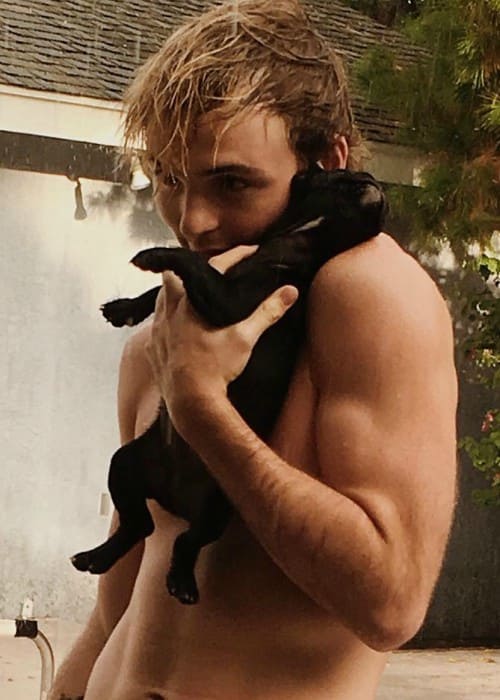 Ryland Lynch with his dog as seen in August 2017