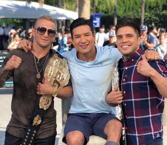 TJ Dillashaw (Left) with Mario Lopez and Henry Cejudo (Right) at Universal Studios Hollywood in August 2018