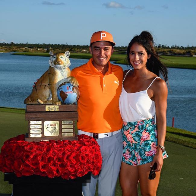 Allison Stokke and Rickie Fowler with the trophy at Hero World Challenge in December 2017