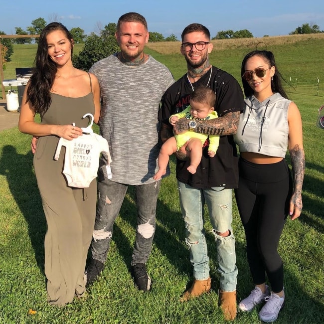 Cody Garbrandt holding his baby in a picture with his family in August 2018