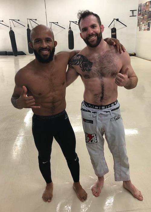 Demetrious Johnson with fellow MMA artist Jordan Galaugher (Right) in June 2018