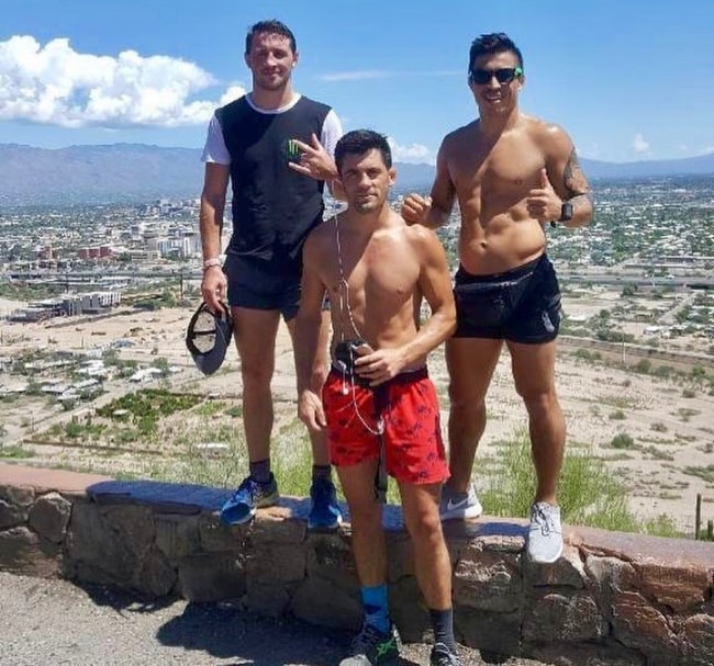 Dominick Cruz with Orlando Jimenez (Right) and Brendan Loughnane (Left) in Tucson, Arizona in September 2018