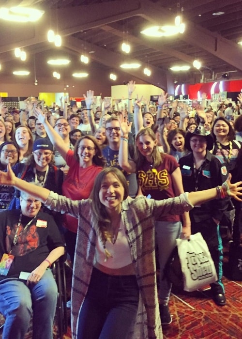 Dominique Provost-Chalkley posing with a bunch of admirers at ClexaCon 2018